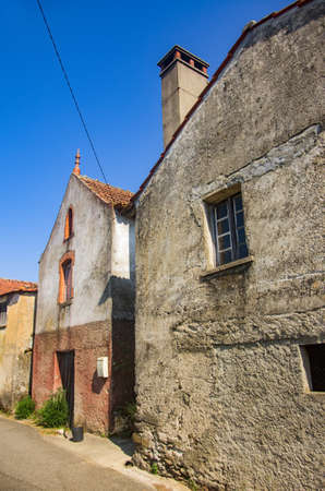 Deserted street on an old village with old rural housesの写真素材