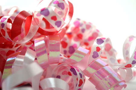 curly celebratory ribbon isolated on white close upの写真素材