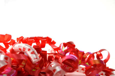 curly celebratory ribbon isolated on white close upの写真素材