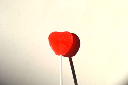 heart lollipop isolated on white background close upの写真素材
