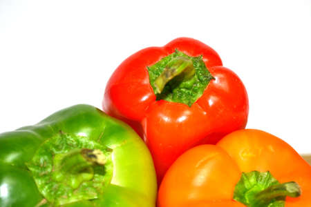 red orange and green peppers isolated on white backgroundの写真素材