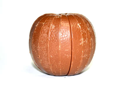 chocolate orange isolated on white background close upの写真素材