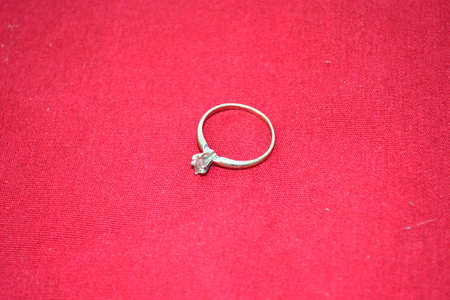 jewellery isolated on red backgroundの写真素材