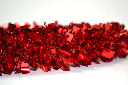 shiny red garland isolated on white background close upの写真素材