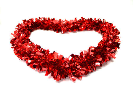 red garland in heart shape isolated on white background close upの写真素材