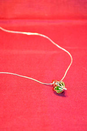 jewellery isolated on red backgroundの写真素材