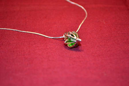 jewellery isolated on red background close upの写真素材