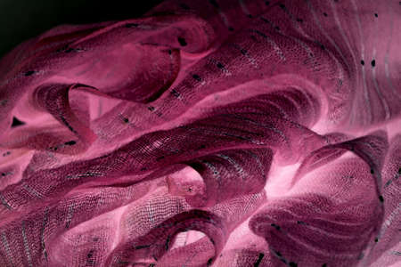 glowing pink woven scarf close upの写真素材