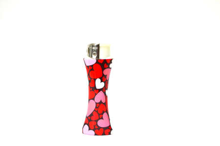 heart decorated lighter isolated on white backgroundの写真素材