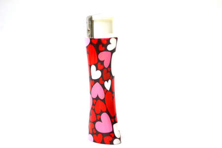 heart decorated lighter isolated on white background close upの写真素材