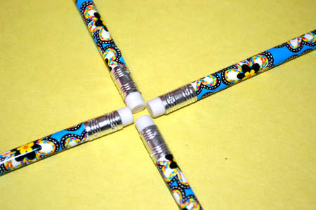 pencil tops coming to a point isolated on pale yellow background close upの写真素材