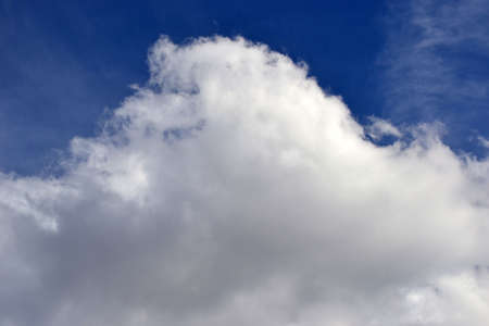 blue sky with large fluffy white cloudの写真素材