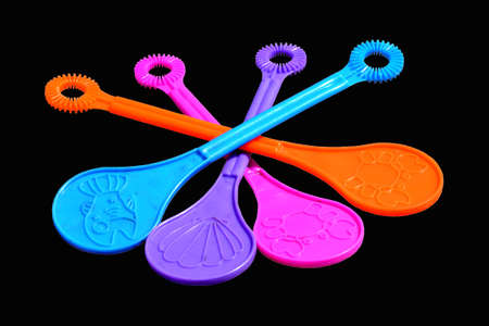 Bubble wands isolated on blackの写真素材