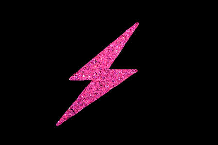 Pink glitter lightning bolt isolated on black backgroundの写真素材