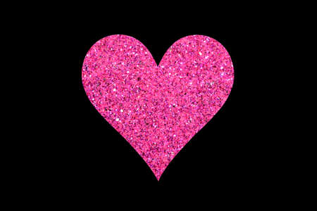 Pink glitter heart isolated on black backgroundの写真素材