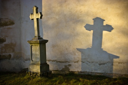 Lonely grave in rays of sunshine 