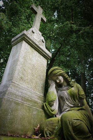Old grave with woman statueの写真素材