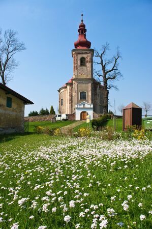 Church and fresh flowered madowの写真素材