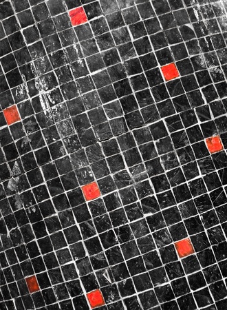 Black mosaic with few red blocksの写真素材
