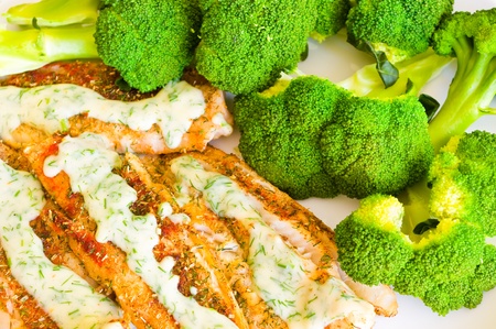 Fish with broccoli and dill sauceの写真素材