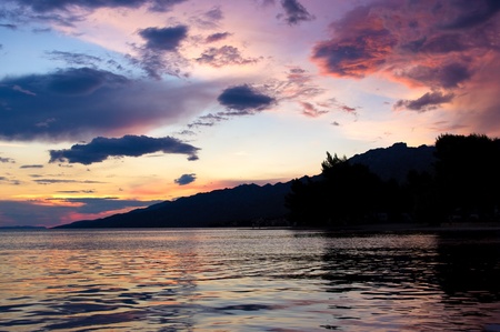 Dramatic sunset over the seashoreの写真素材