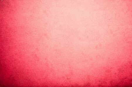 Surface of old red paper with circular gradientの写真素材