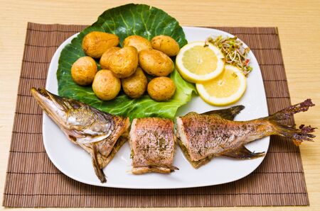 Fresh baked pike with potatoes
