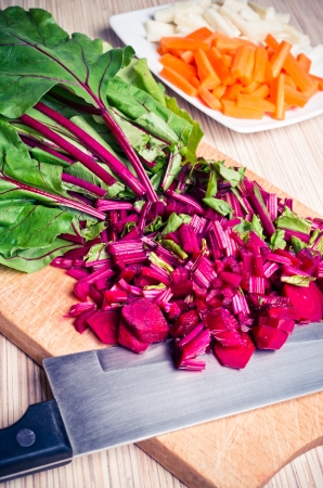 Cutted chard on the wooden board ready to soup makingの写真素材