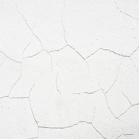 Cracked surface of old white wallの写真素材