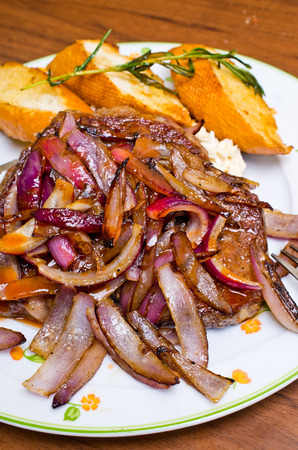 Delicious steak with red onionの写真素材