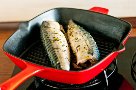Fresh mackrel cooked on grill panの写真素材