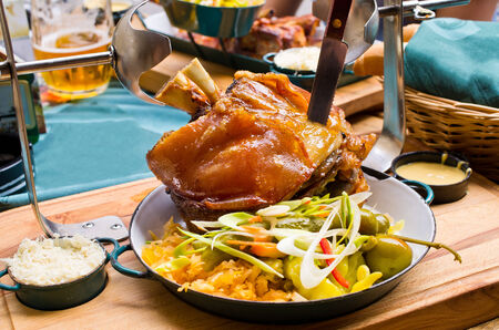 Tasty pork knuckle with mustard and horseradishの写真素材