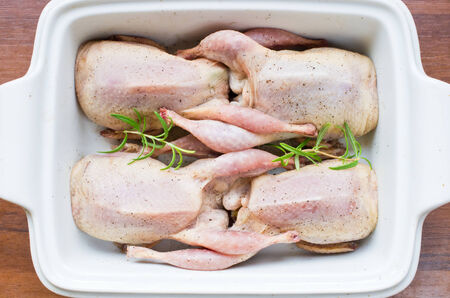 Fresh quails prepared to bakingの写真素材