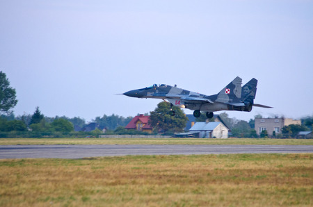RADOM, POLAND - AUGUST 23, 2015: Display of polish Mig-29 piloted by Cpt. Adrian Rojek. Airshow event on 23 August 2015, Radom, Polandのeditorial素材