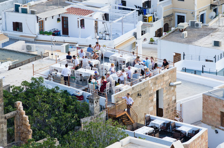 Lindos, Greece - July 20, 2016: the town. archaeological site, Fishing village and a former...
