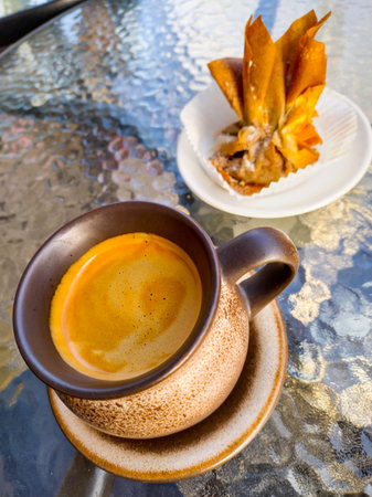 Savor the simple pleasures with rich coffee and a delectable pastry. Enjoy a quiet moment in the sun...