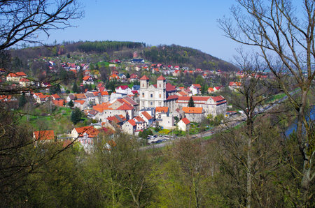 Explore a charming European village with red rooftops. Perfect for travel, tourism, and historical content. Evokes a sense of culture, tradition, and picturesque beauty.の写真素材