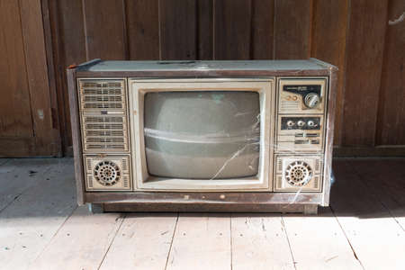 retro tv with wooden case in roomの写真素材