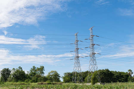 transmission High voltage electricity pylon with blue sky backgroundの写真素材