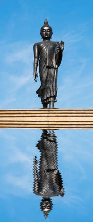 Buddha statue on blue sky backgroundの写真素材