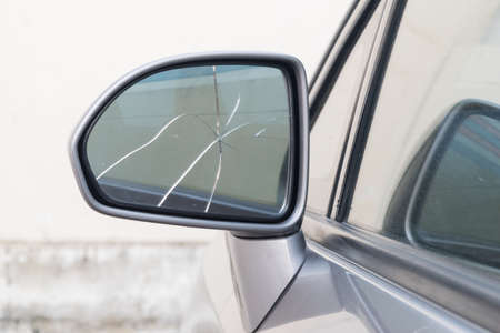 damaged rear view mirror on a carの写真素材