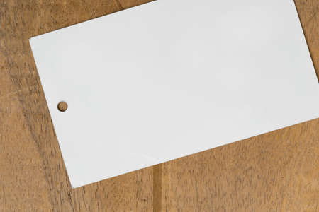 Close up blank price tag on wood backgroundの写真素材