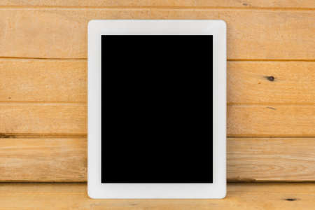 White tab on brown wood table backgroundの写真素材