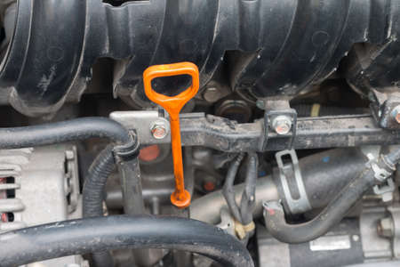 equipment to check engine oil level of car before change or  maintenance, oil stick in the carの写真素材