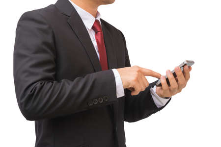 Businessman in the suit is using smartphone