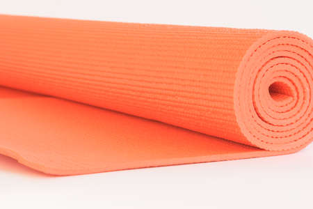 Macro Orange mat for Yoga isolate on white backgroundの写真素材