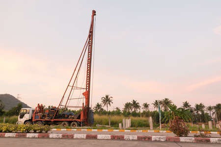 Pile driving or crane work in eveningの写真素材