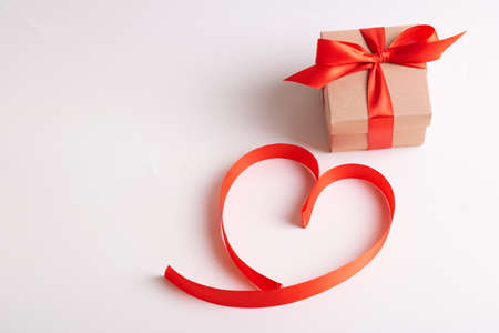 Red hearts from ribbons and gift box on a white backgroundの写真素材