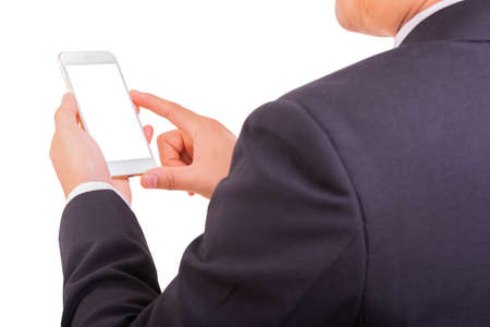 Businessman use smart phone while hand holding new smartphone and looking white background, rear view. Business concept.の写真素材