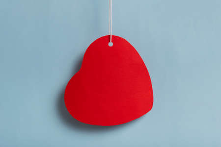 Red heart sales tag. Black friday sale concept. Red heart sale tag color on bule color background...
